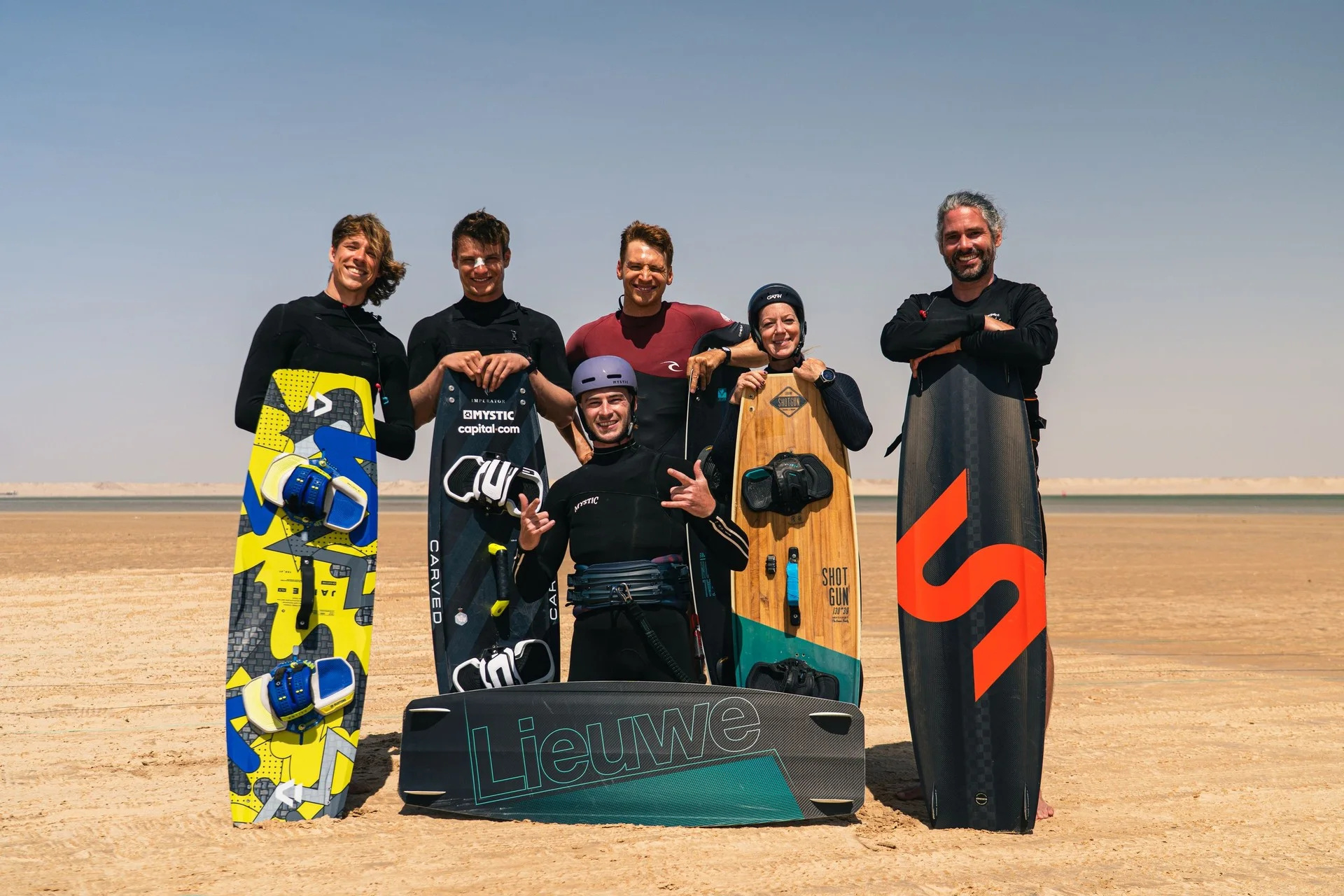 DC Kitesurfing riders together on the beach with their boards